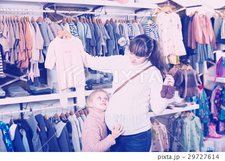Woman decided to purchase sliders and dresses Woman decided to purchase sliders and dresses 29727614