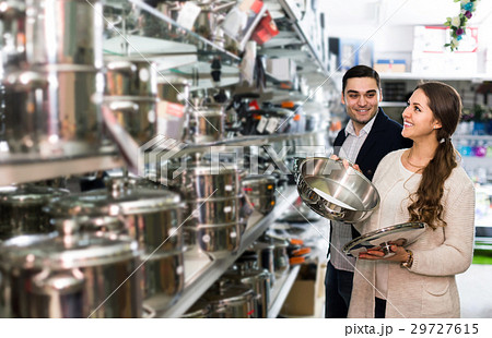 couple chooses pans in shop cookware couple chooses pans in shop cookware 29727615