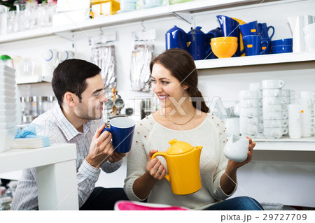 Couple buying ceramic tableware 29727709