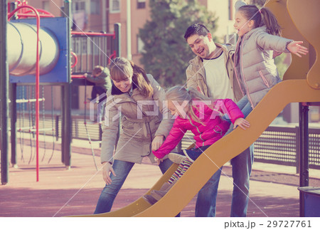 Parents playing with little daughters Parents playing with little daughters 29727761