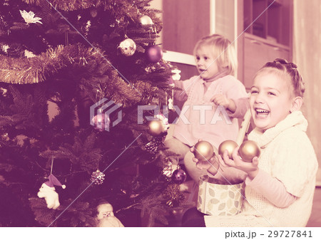 Happy children decorating a fir Happy children decorating a fir 29727841