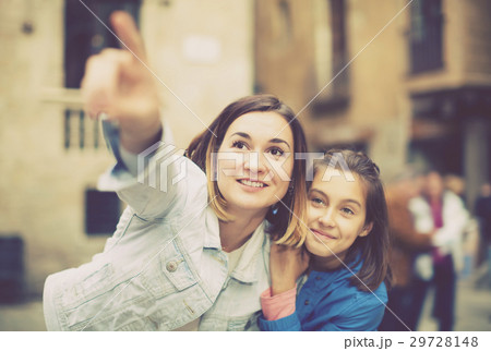 Mother pointing to daughter new sight Mother pointing to daughter new sight 29728148