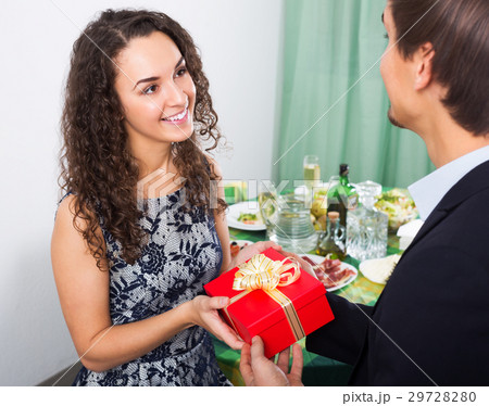 Man giving present to woman 29728280
