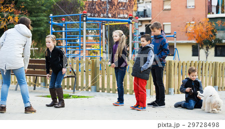 Children playing skipping rope Children playing skipping rope 29728498