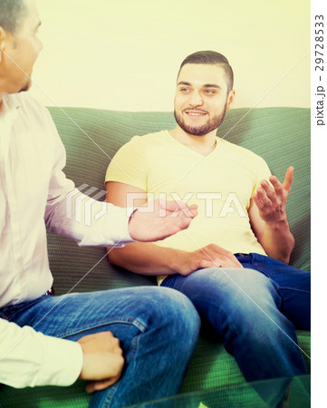 Father and son having conversation Father and son having conversation 29728533