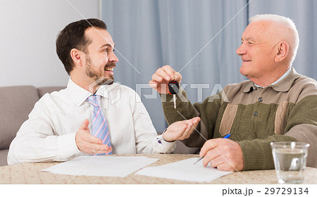 Old man and manager signed contract car lease Old man and manager signed contract car lease 29729134