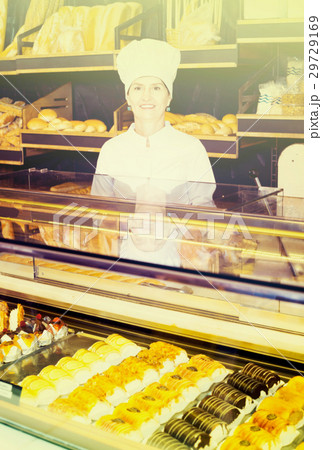 female baker offering fresh pastry female baker offering fresh pastry 29729169