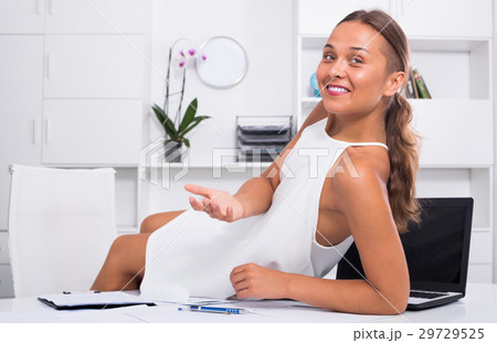 Young female relaxing on desk with documents 29729525