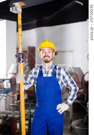 working man practicing his skills erect trestle at workshop 29730036