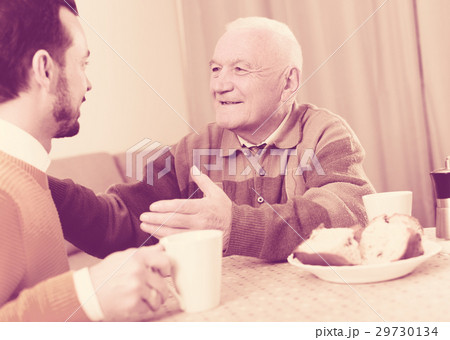 Elderly father and son breakfast Elderly father and son breakfast 29730134