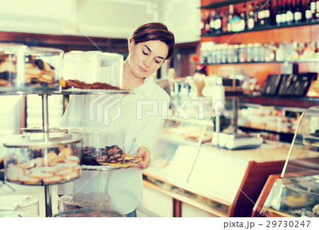 Woman choosing dessert Woman choosing dessert 29730247