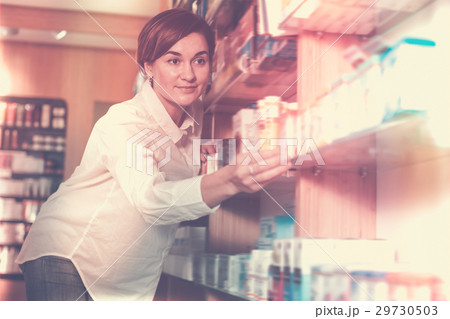 Young female searching for body care products 29730503