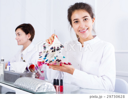 Girl doing nails displaying her workplace 29730628