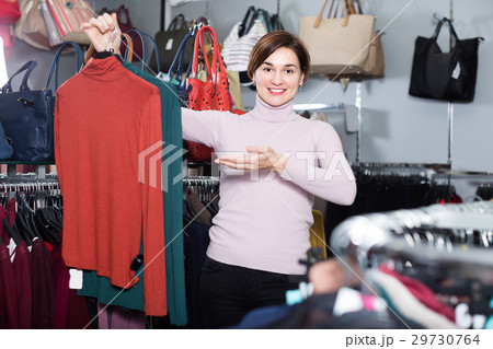 Brunette young woman enjoying her purchases Brunette young woman enjoying her purchases 29730764