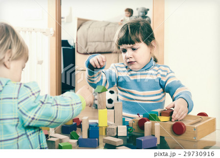 Baby playing with toy blocks 29730916