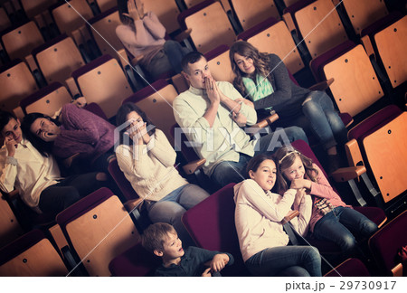 Group people watching movie night for horror 29730917