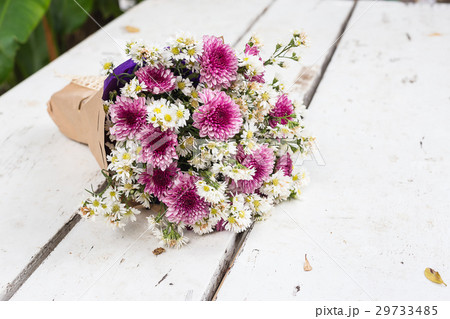 Bunch flowers gift on white floor Bunch flowers gift on white floor 29733485