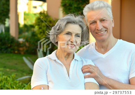Happy elderly couple embracing 29737553