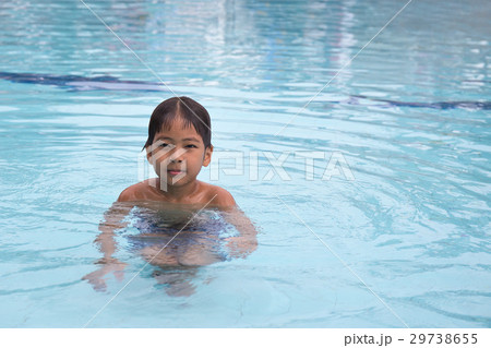 8 years old Asian kid swimming lonely 8 years old Asian kid swimming lonely 29738655