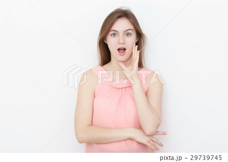 Young casual woman In pink blouse isolated over 29739745