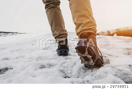 a man hiking on snow mountain in winter 29739951
