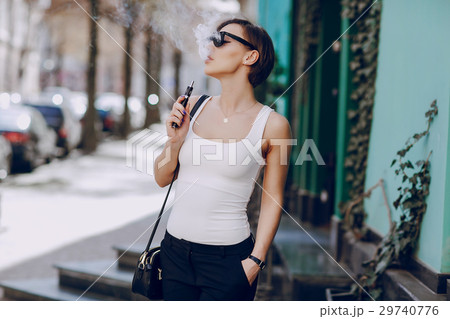 girl with the electronic cigarette girl with the electronic cigarette 29740776