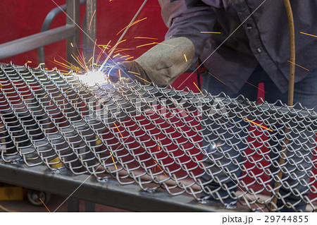 welding a net table with flash light 29744855