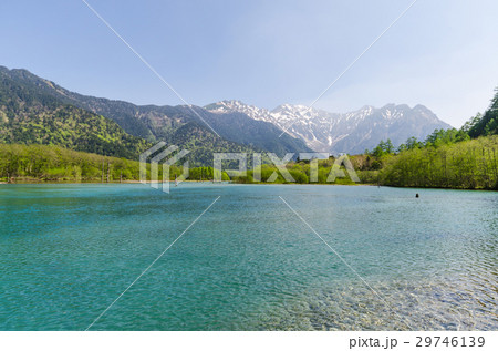 Hotaka mountain range and taisho pond at kamikochi Hotaka mountain range and taisho pond at kamikochi 29746139