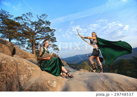 Two female elves walking in the woods Two female elves walking in the woods 29748537