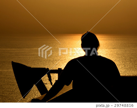 Silhouette man on sunset background Silhouette man on sunset background 29748816