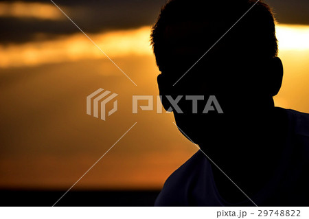 Silhouette man on sunset background Silhouette man on sunset background 29748822