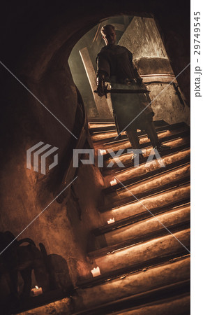 Medieval knight in ancient castle interior. 29749545