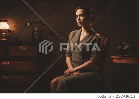 Beautiful young woman in retro interior 29749613