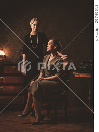 Two beautiful young women in retro interior Two beautiful young women in retro interior 29749615