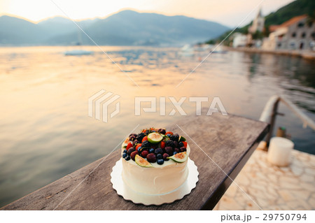 Wedding cake of figs, cherries and berries with a Wedding cake of figs, cherries and berries with a 29750794