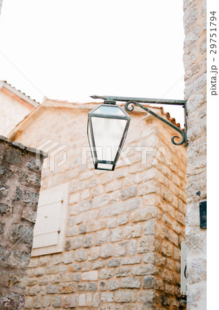 Vintage lamp on wall on street 29751794