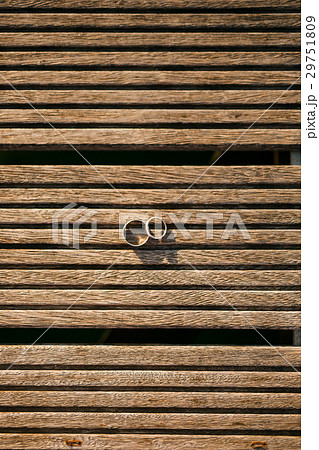 Wedding rings on a light wooden texture Wedding rings on a light wooden texture 29751809