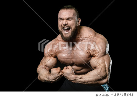 Handsome athletic man training pumping up muscles Handsome athletic man training pumping up muscles 29759843