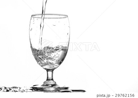 Pouring water into a glass Pouring water into a glass 29762156