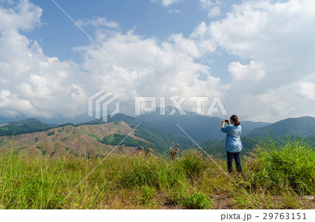 Female traveler taking a photo with smartphone 29763151