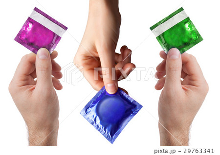 set of colored condom in female and man's hands 29763341