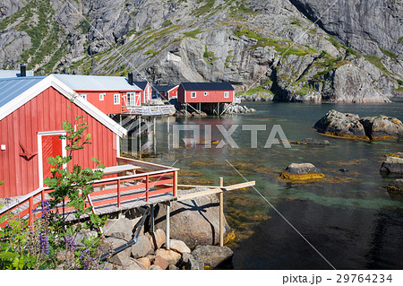 Red and yellow wooden fishing cabins in Norway Red and yellow wooden fishing cabins in Norway 29764234