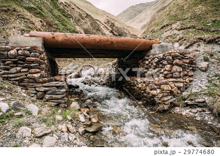 Bridge Through Terek River In In Truso Gorge 29774680