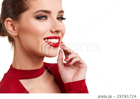 Portrait of a cheerful young brunette woman in red dress posing Portrait of a cheerful young brunette woman in red dress posing 29781724