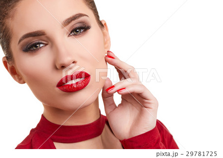 Portrait of a cheerful young brunette woman in red dress posing Portrait of a cheerful young brunette woman in red dress posing 29781725