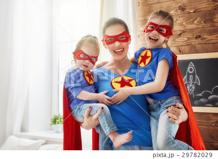 Girls and mom in Superhero costumes Girls and mom in Superhero costumes 29782029