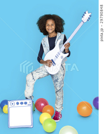 Portrait of a Little African Descent Girl with a Guitar Isolated 29790848