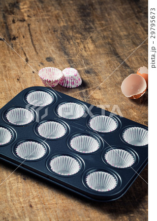 Empty black  metal tray ready for cupcakebutter  29795673