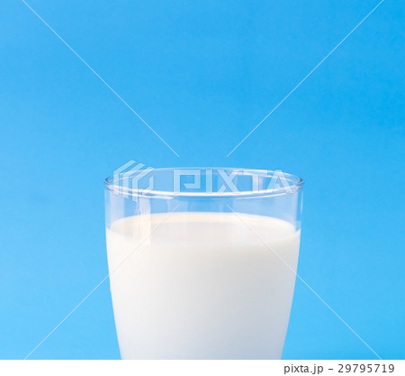 Closeup glass of milk on blue background 29795719