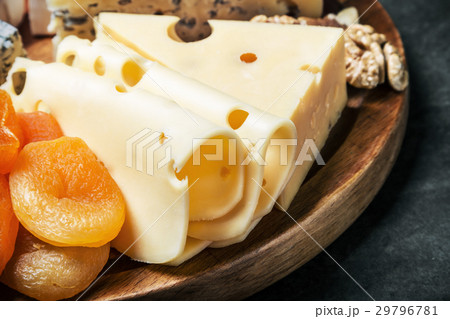 variety of cheeses with grapes and dried fruits 29796781